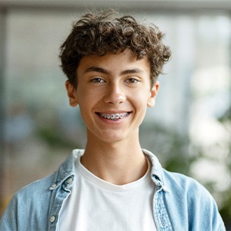 A kid with braces smiling