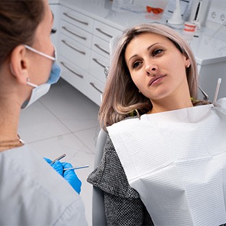 A patient visiting her dentist for a checkup