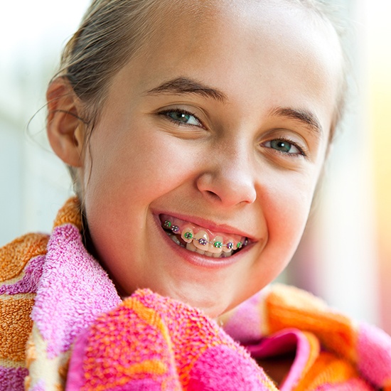 Smiling girl with pediatric orthodontics