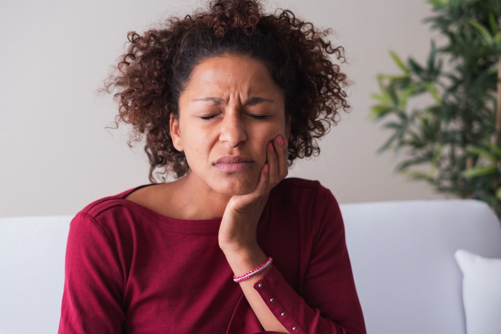 Closeup of woman experiencing toothache