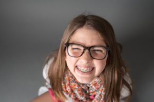 a closeup of a child with braces 