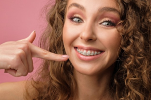 a patient with braces smiling