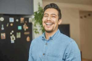 a patient with braces smiling