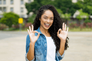a teen with braces smiling